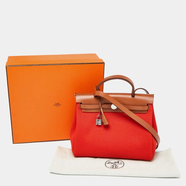 Pre Owned Hermes Orange/Fauve Canvas and Leather Herbag Zip 31 Bag