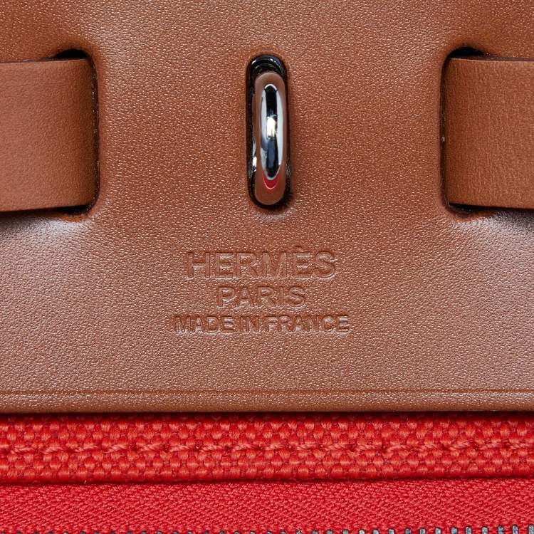 Pre Owned Hermes Orange/Fauve Canvas and Leather Herbag Zip 31 Bag