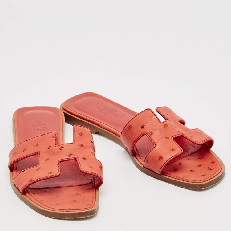Pre Owned Hermes Orange Ostrich Leather Oran Flat Slides Size 36.5