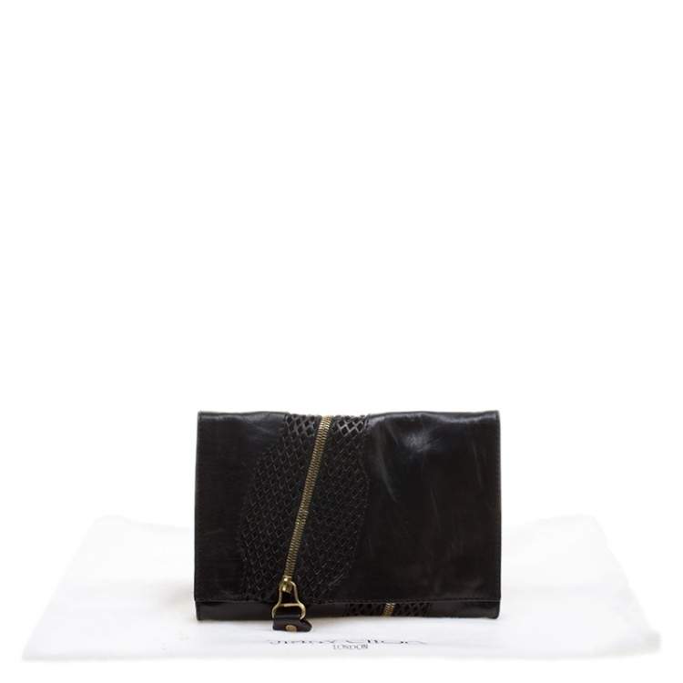 مملوكة مسبقًا Jimmy Choo Black Perforated Leather Martha Clutch