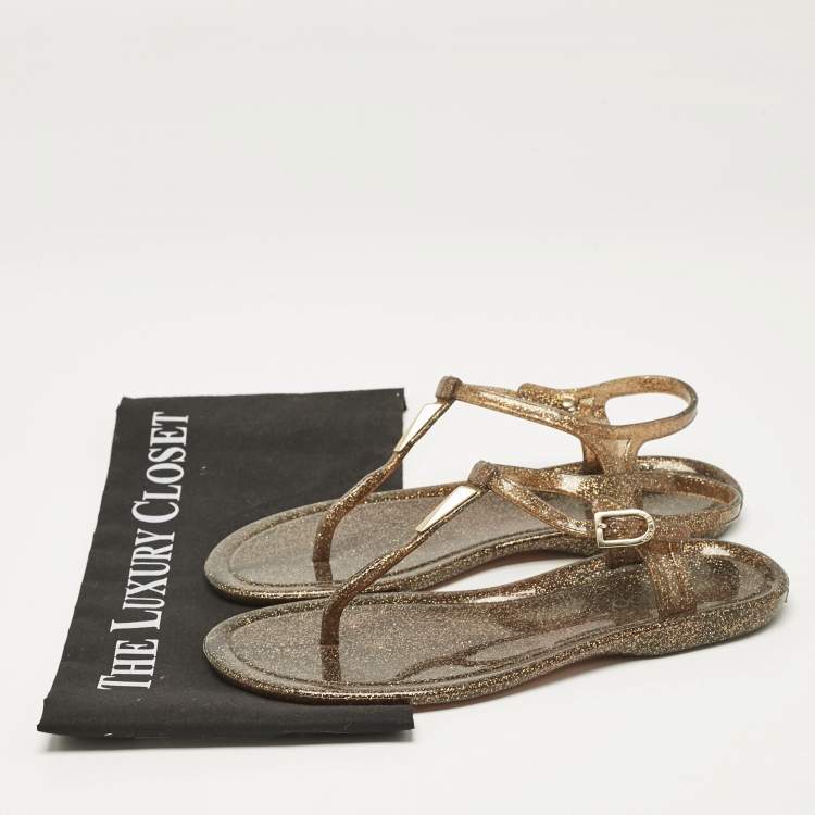 مملوكة مسبقًا Jimmy Choo Metallic Gold Rubber T Strap Thong Flats Sandals Size 37