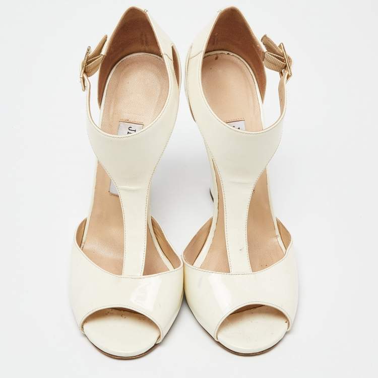 Pre Owned Jimmy Choo White/Cream Patent Leather Token T Strap Wedges Size 38.5