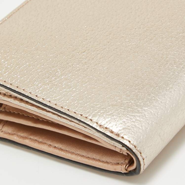 Pre Owned Kate Spade Metallic Peach Leather  Wellesley Wristlet Wallet