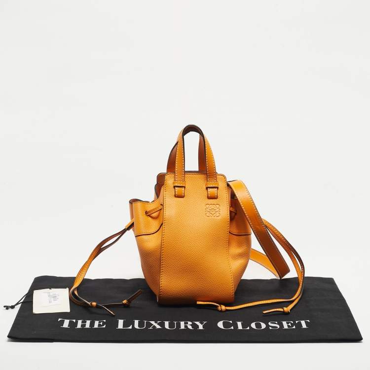 Pre Owned Loewe Orange Leather Mini Hammock Drawstring Bag