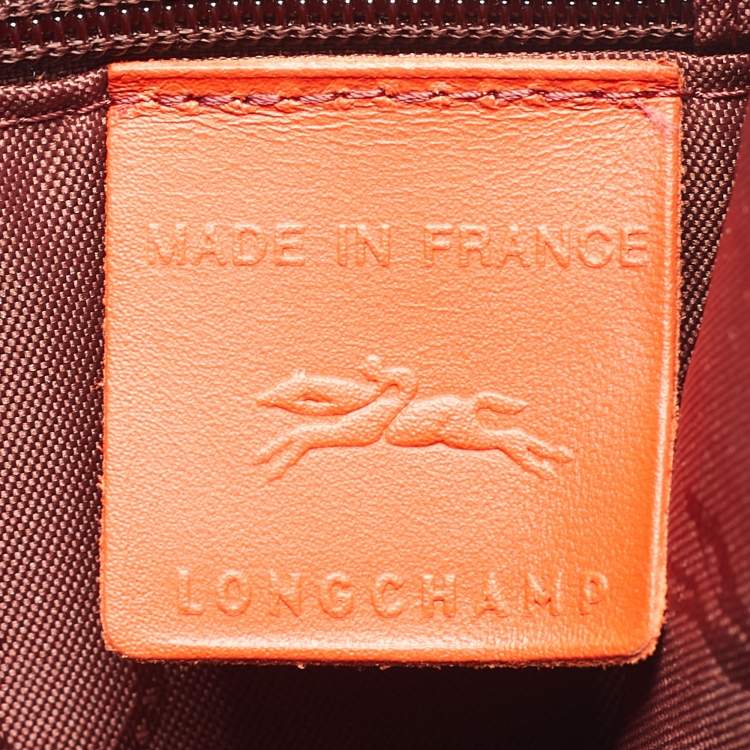 Pre Owned Longchamp Red Monogram Embossed Leather La Voyageuse Vertical Tote