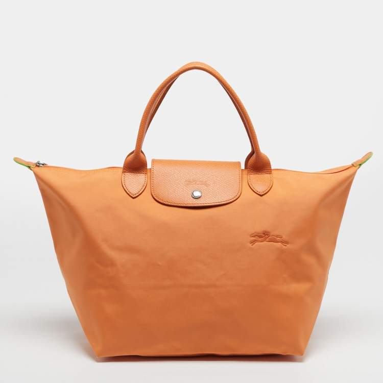 مملوكة مسبقًا Longchamp Le Pliage Medium Orange Nylon Tote