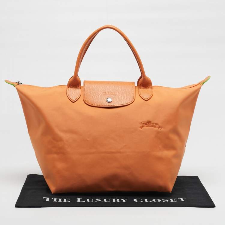 مملوكة مسبقًا Longchamp Le Pliage Medium Orange Nylon Tote