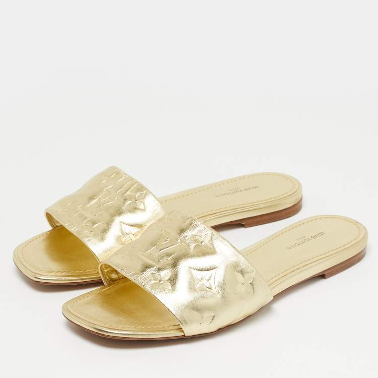 Pre Owned Louis Vuitton Gold Monogram Embossed Leather Revival Flat Slides Size 37.5