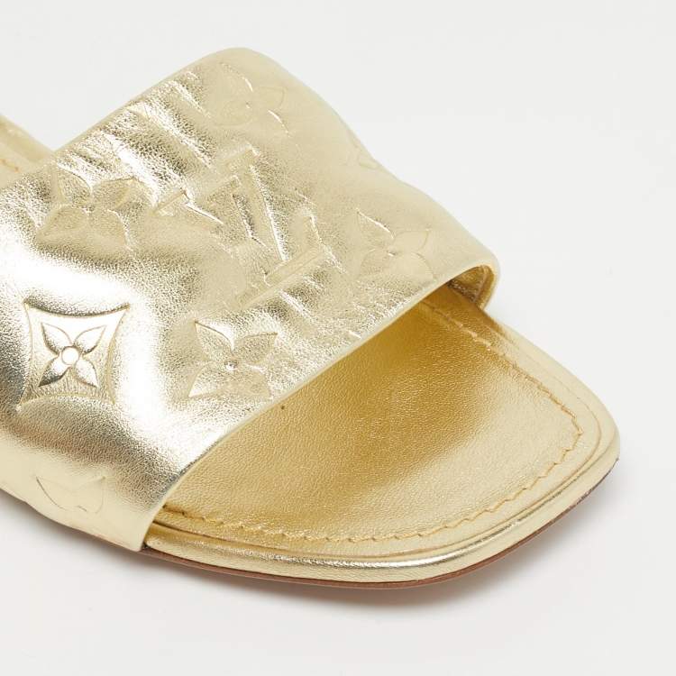 Pre Owned Louis Vuitton Gold Monogram Embossed Leather Revival Flat Slides Size 37.5