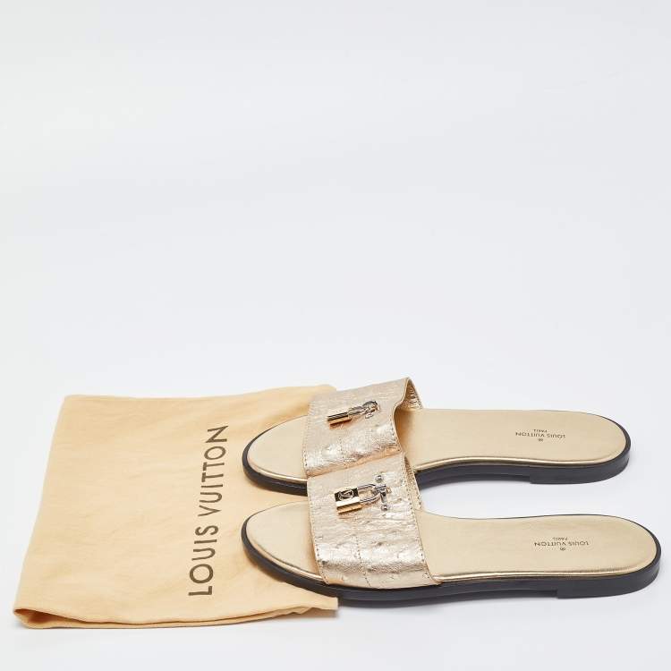 Pre Owned Louis Vuitton Gold Ostrich Leather Lock It Flat Sandals Size 38