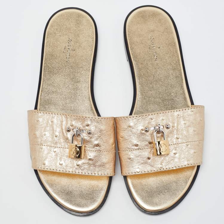 Pre Owned Louis Vuitton Gold Ostrich Leather Lock It Flat Sandals Size 38