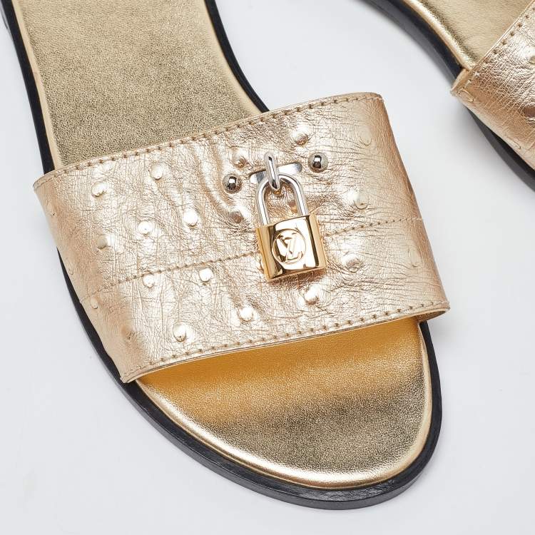 Pre Owned Louis Vuitton Gold Ostrich Leather Lock It Flat Sandals Size 38