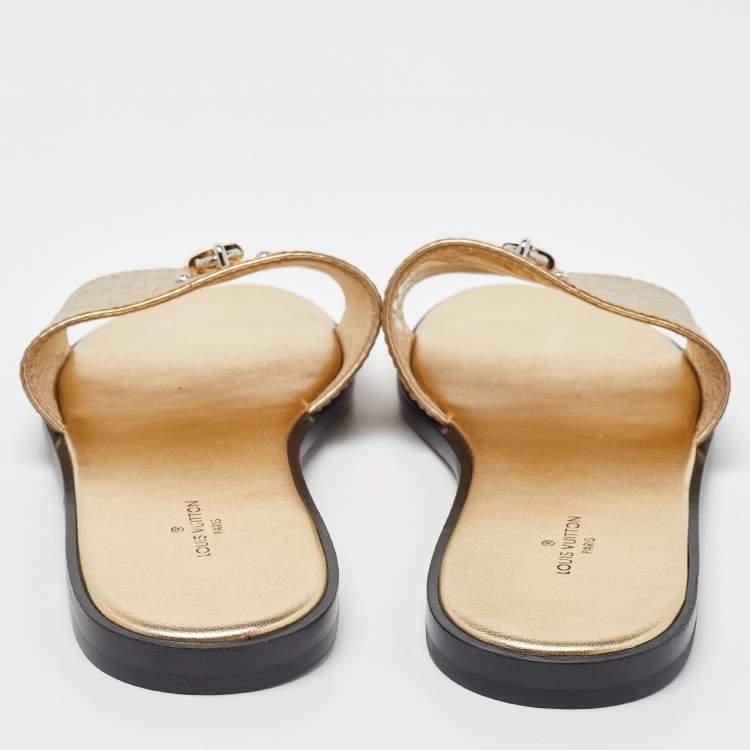 Pre Owned Louis Vuitton Gold Ostrich Leather Lock It Flat Sandals Size 38