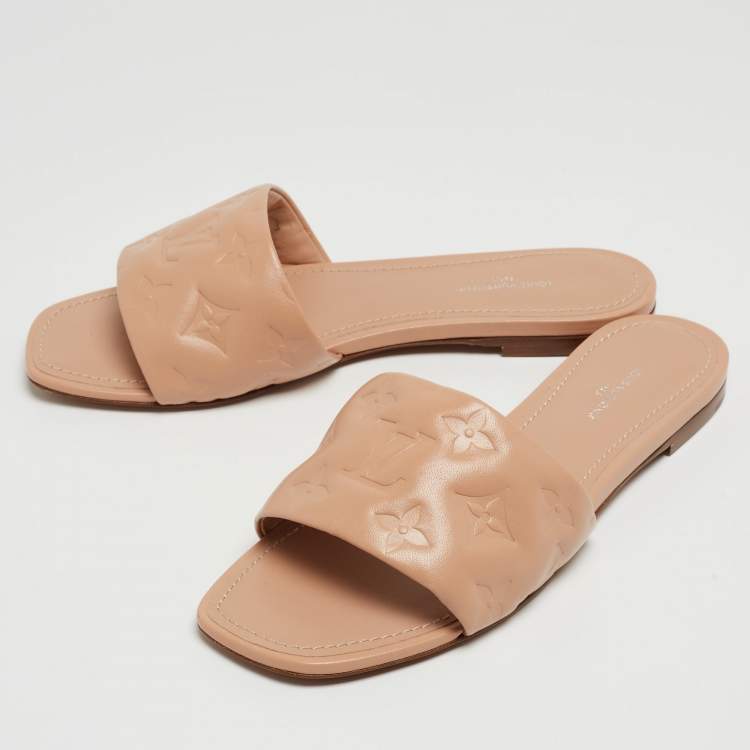 Pre Owned Louis Vuitton Beige Monogram Embossed Leather Revival Flat Mules Size 38