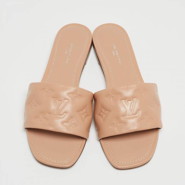 Pre Owned Louis Vuitton Beige Monogram Embossed Leather Revival Flat Mules Size 38