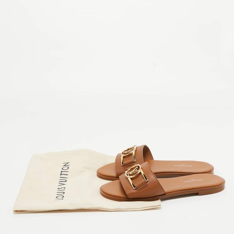 مملوكة مسبقًا Louis Vuitton Tan Leather Lock It Flat Slides Size 36