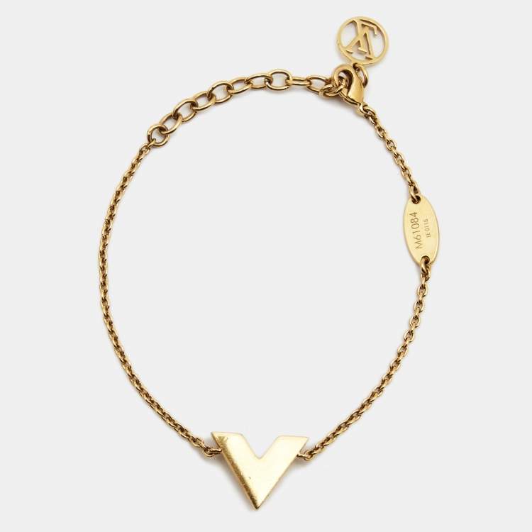 Gold Essential V bracelet with crystals in a gradient from red, orange,  yellow to white. LV logo on e…