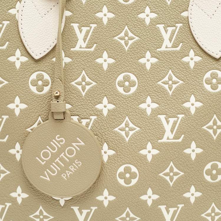 Pre Owned Louis Vuitton Khaki/Beige Monogram Empreinte Leather Spring In The City Neverfull MM Bag