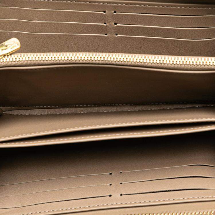Pre Owned Louis Vuitton Beige Leather Monogram Zippy Wallet