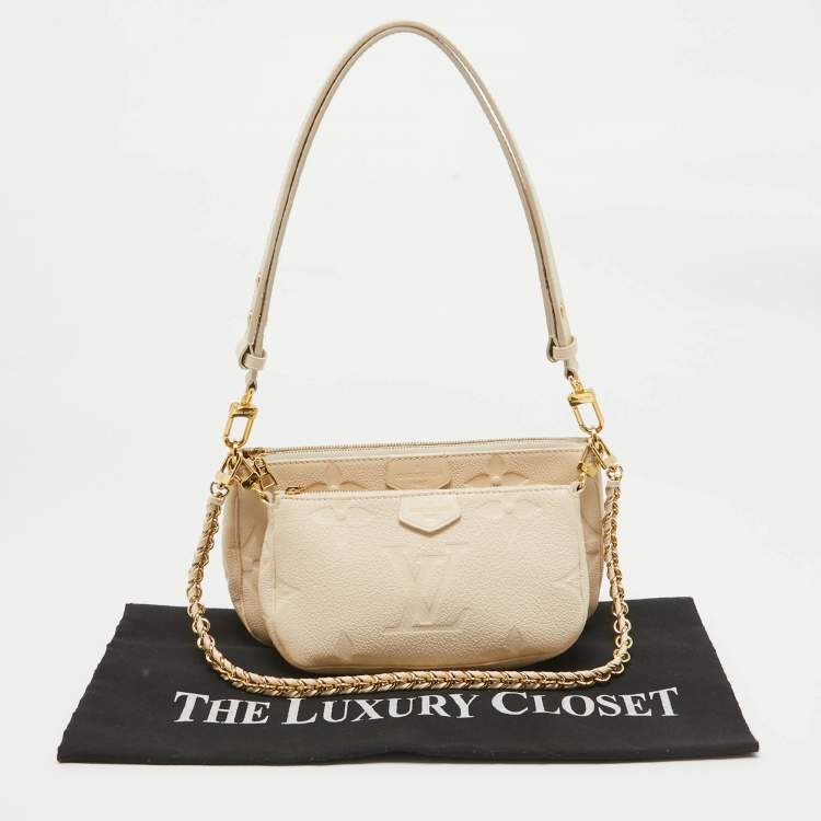 Pre Owned Louis Vuitton Cream Empreinte Leather Multi Pochette Accessoires Bag
