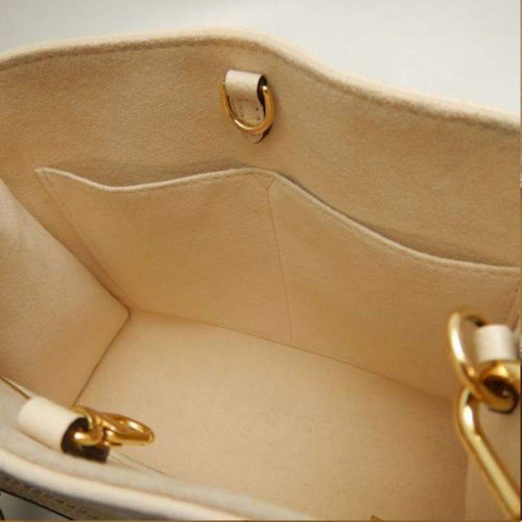 Pre Owned Louis Vuitton Cream Bicolor Monogram Empreinte Leather OnTheGo PM Tote Bag