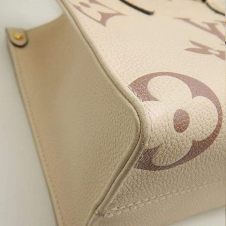 Pre Owned Louis Vuitton Cream Bicolor Monogram Empreinte Leather OnTheGo PM Tote Bag