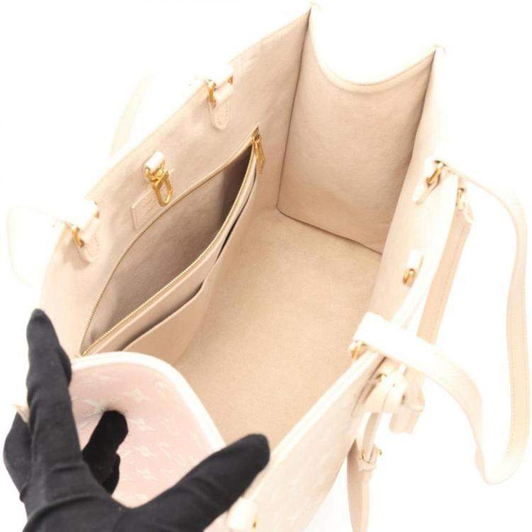 Pre Owned Louis Vuitton OnTheGo MM Rose Beige Monogram Empreinte Leather Tote Bag