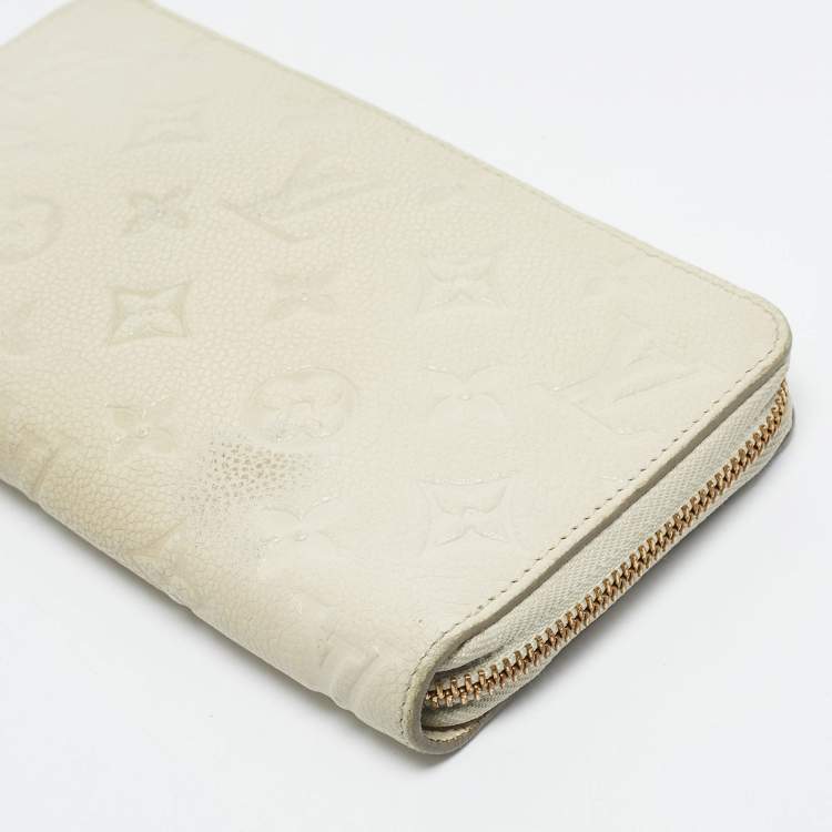 Pre Owned Louis Vuitton Off White Monogram Empreinte Leather Zippy Wallet