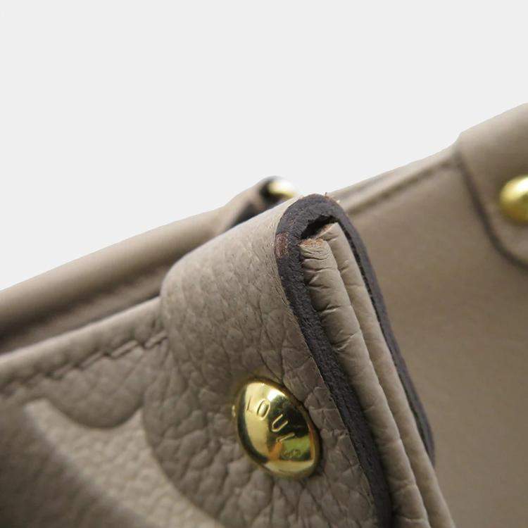 Pre Owned Louis Vuitton Onthego Tourterelle Claim Bicolor Monogram Empreinte Leather Monogram Giant Size Pm