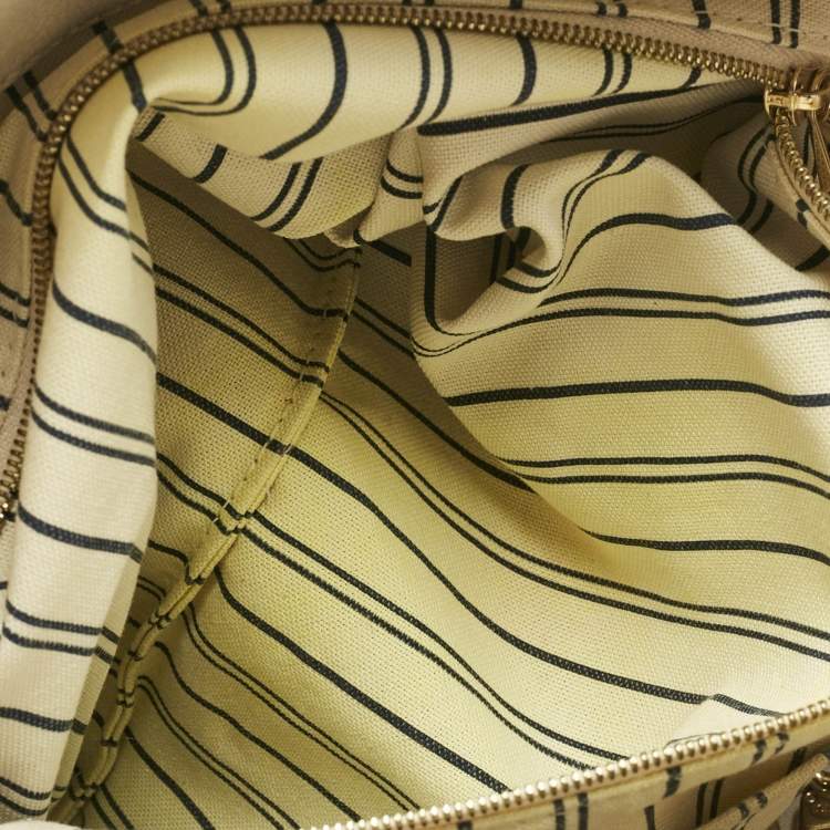 Pre Owned Louis Vuitton Neige Monogram Empreinte Leather Artsy MM Bag