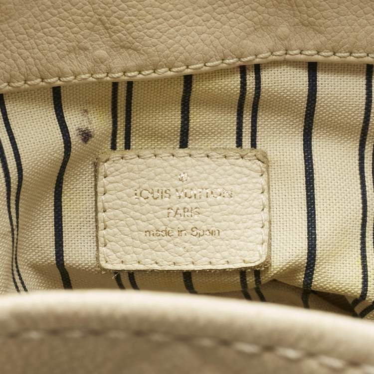 Pre Owned Louis Vuitton Neige Monogram Empreinte Leather Artsy MM Bag
