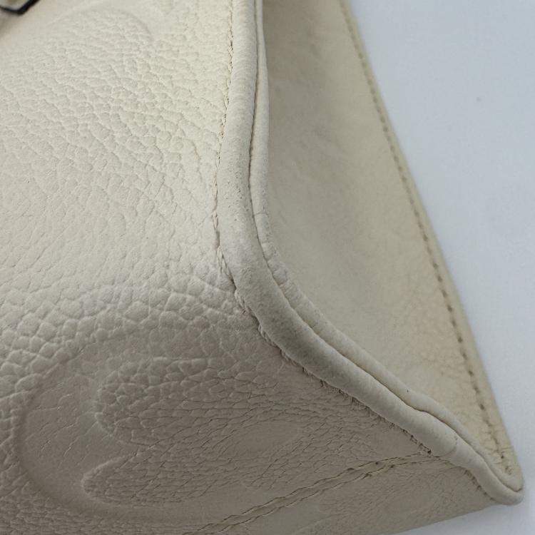 Pre Owned Louis Vuitton Onthego white Monogram Empreinte Leather Size PM
