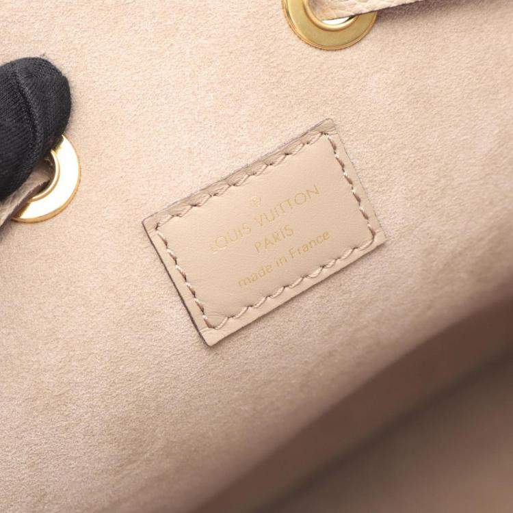 Pre Owned Louis Vuitton Neonoe Mm Two-Tone Handbag In Monogram Empreinte Leather  Beige