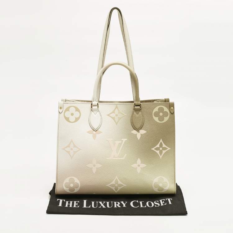 Pre Owned Louis Vuitton Sunset Khaki Monogram Giant Empreinte Leather Onthego MM Bag