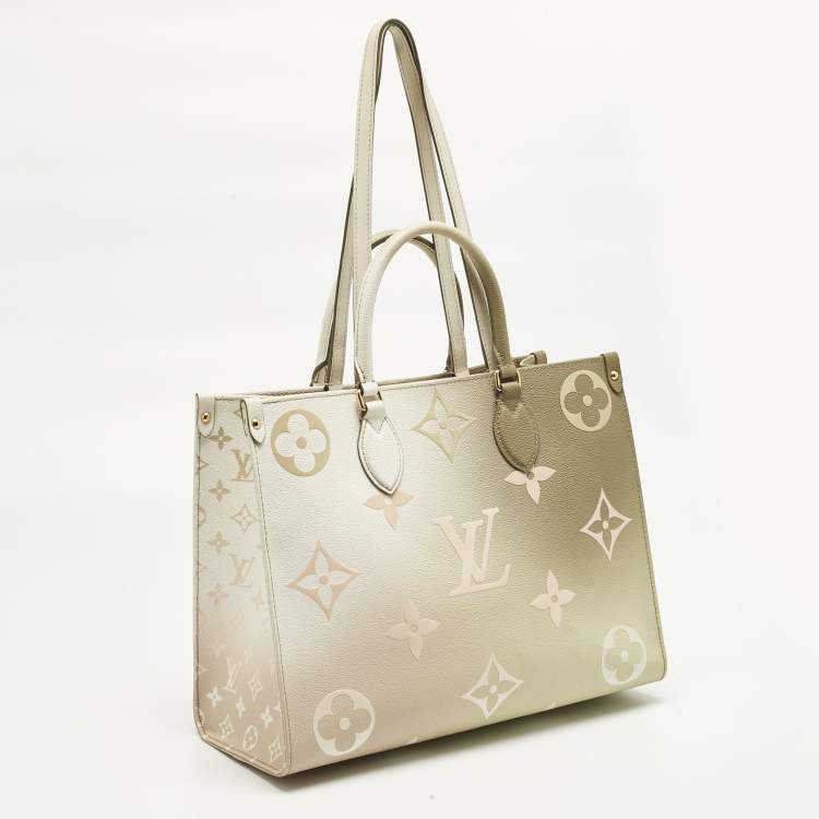 Pre Owned Louis Vuitton Sunset Khaki Monogram Giant Empreinte Leather Onthego MM Bag