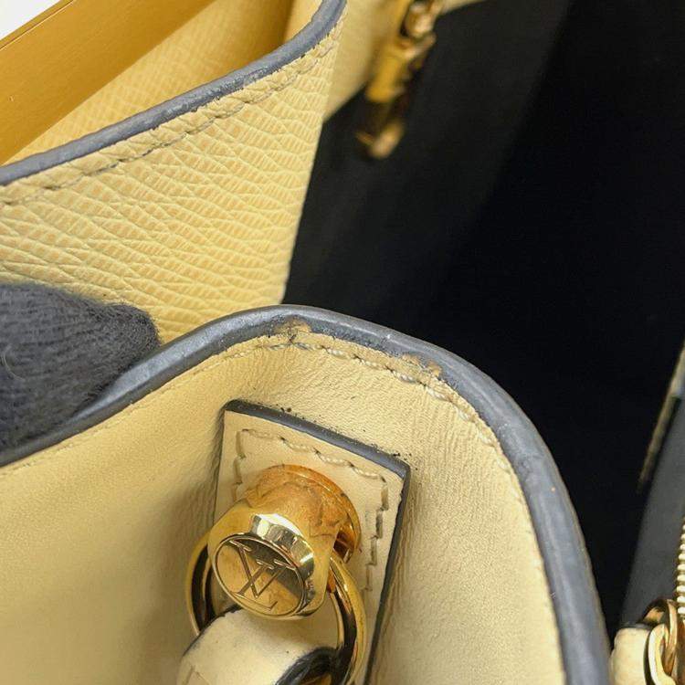 Pre Owned Louis Vuitton City Frame Yellow Taiga Calfskin Leather Top Handle Bag