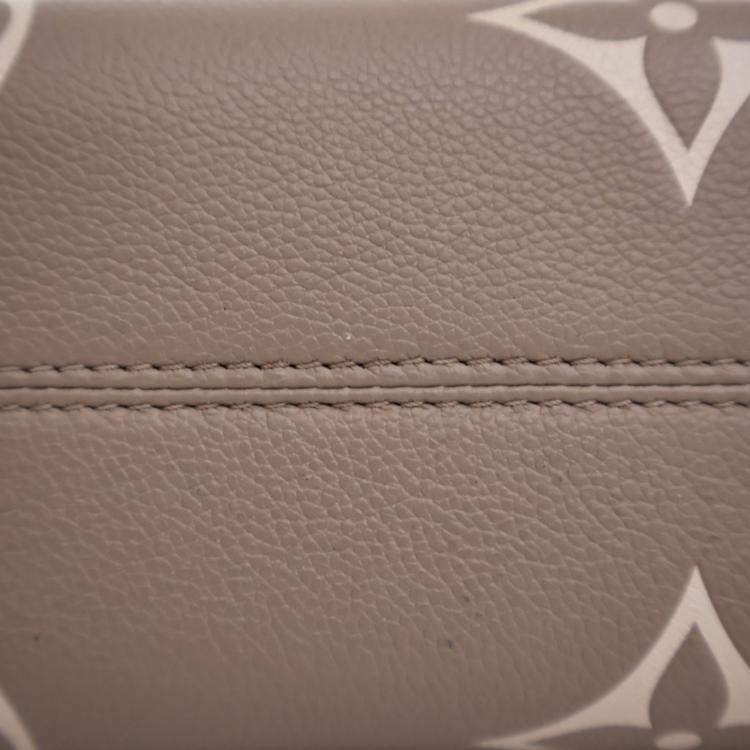 Pre Owned Louis Vuitton Beige Monogram Empreinte Giant OnTheGo PM