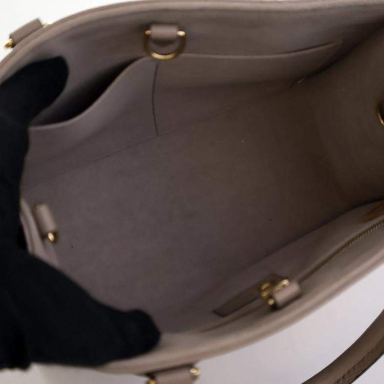 Pre Owned Louis Vuitton Beige Monogram Empreinte Giant OnTheGo PM