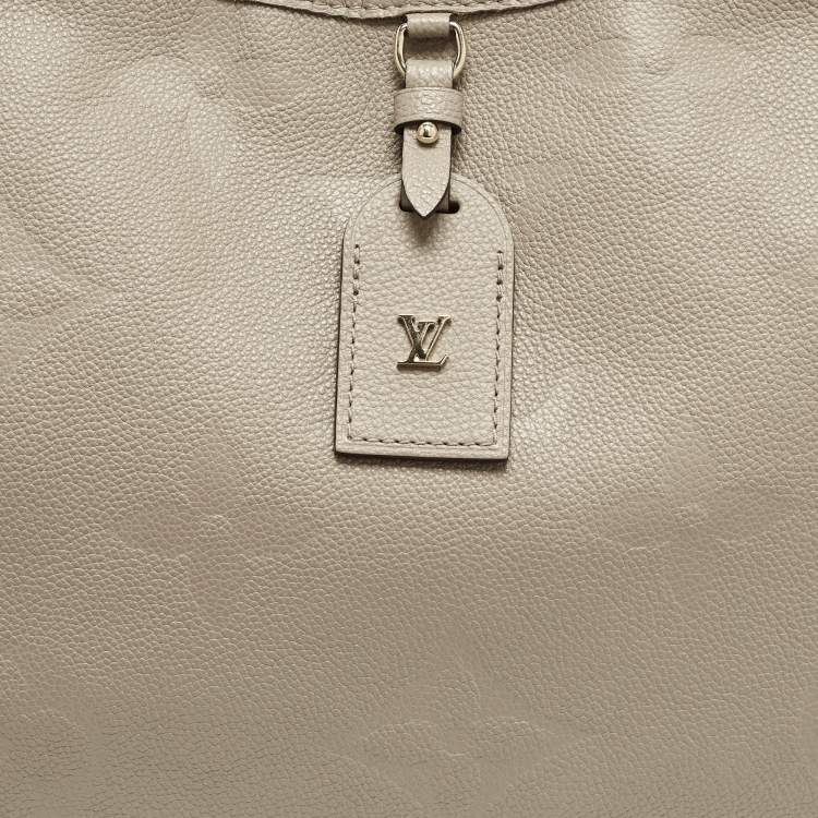 مملوكة مسبقًا Louis Vuitton CarryAll MM Tourterelle Monogram Giant Empreinte Leather Hobo