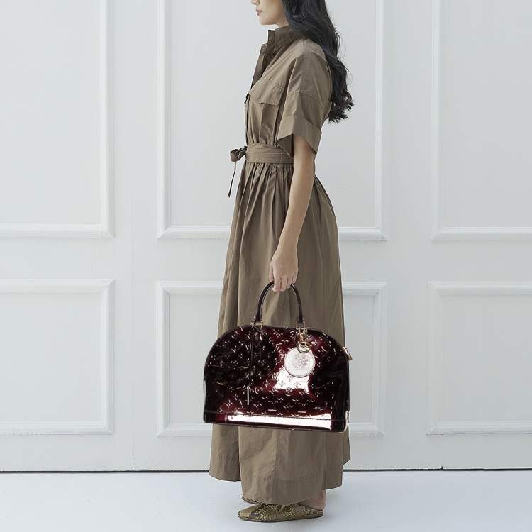Roseberys London  A Louis Vuitton Alma Monogram Vernis handbag, the bag