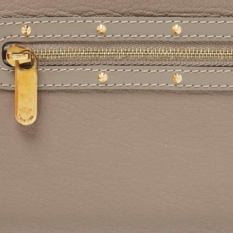 Pre Owned Louis Vuitton Grey Suhali Leather Zip Around Wallet