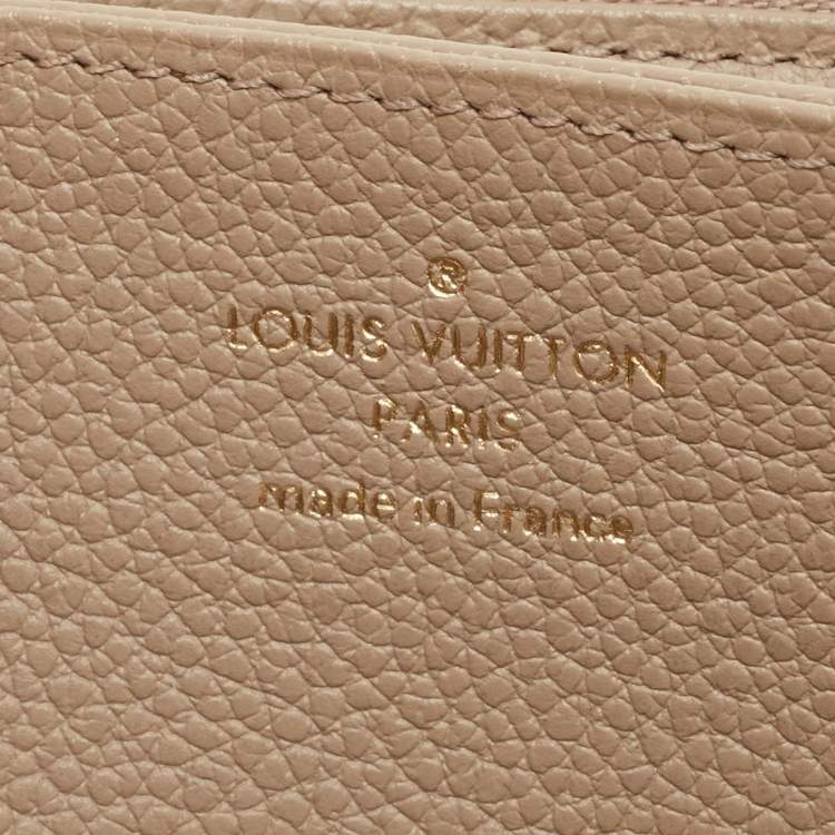 Pre Owned Louis Vuitton Tourterelle/Creme Monogram Empreinte Leather Zippy Wallet