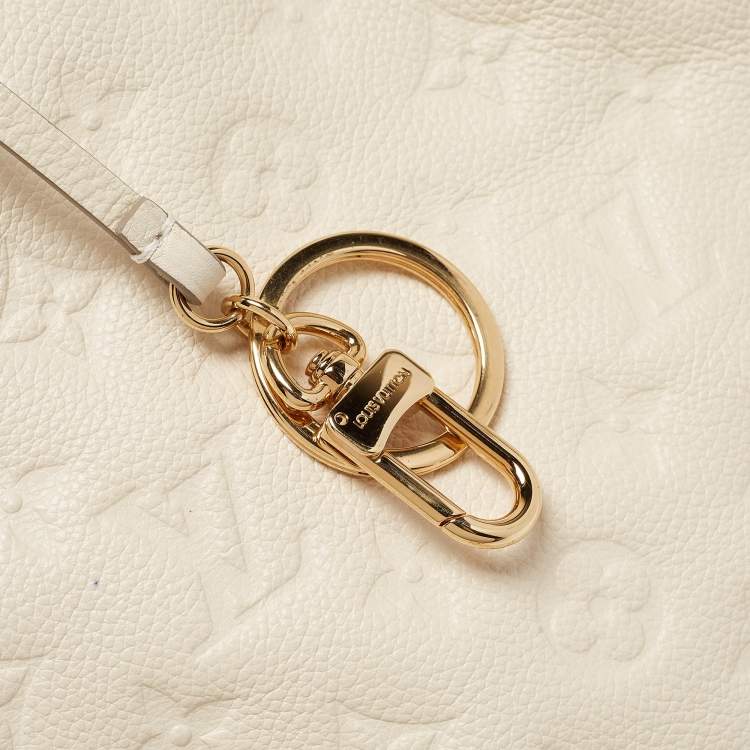 Pre Owned Louis Vuitton Neige Monogram Empreinte Leather Artsy MM Bag