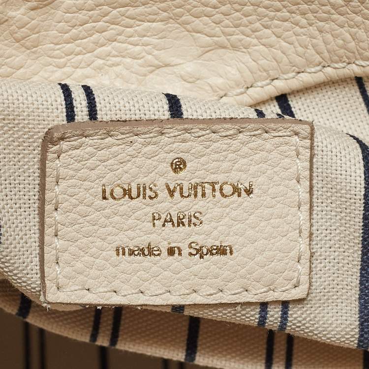 Pre Owned Louis Vuitton Neige Monogram Empreinte Leather Artsy MM Bag