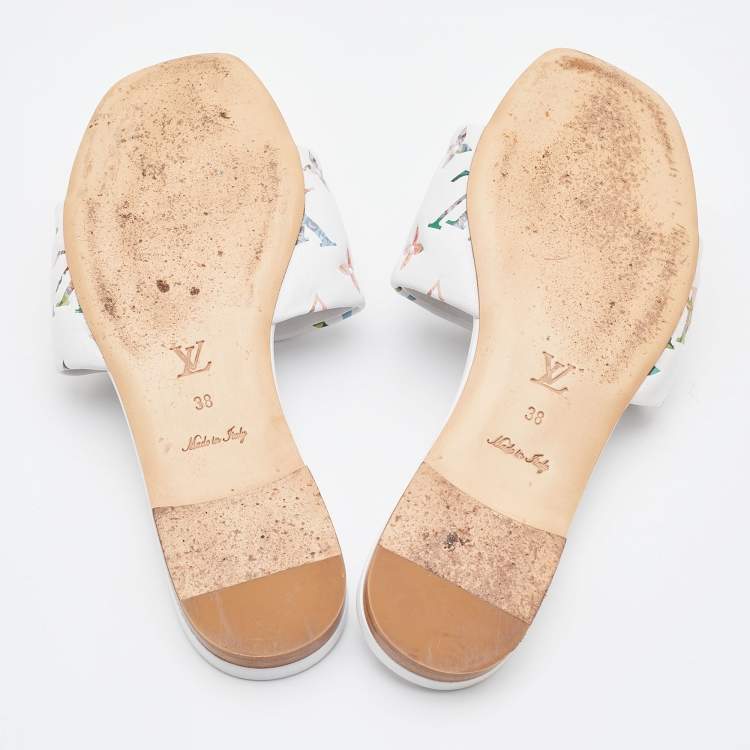 Pre Owned Louis Vuitton White Monogram Embossed Leather Revival Flat Slides Size 38