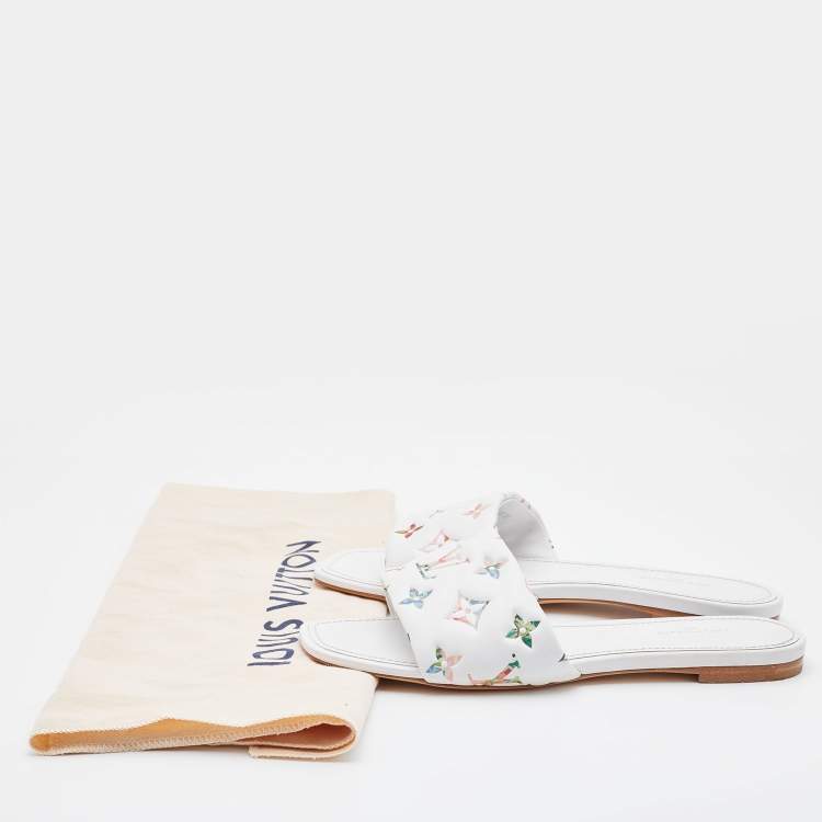 Pre Owned Louis Vuitton White Monogram Embossed Leather Revival Flat Slides Size 38
