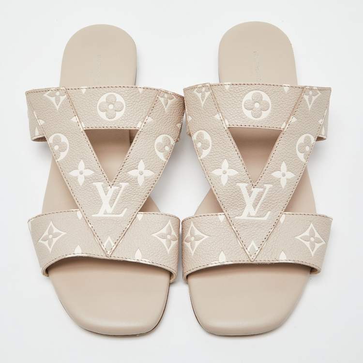 Pre Owned Louis Vuitton Beige/White Monogram Embossed Leather Flat Slides Size 40