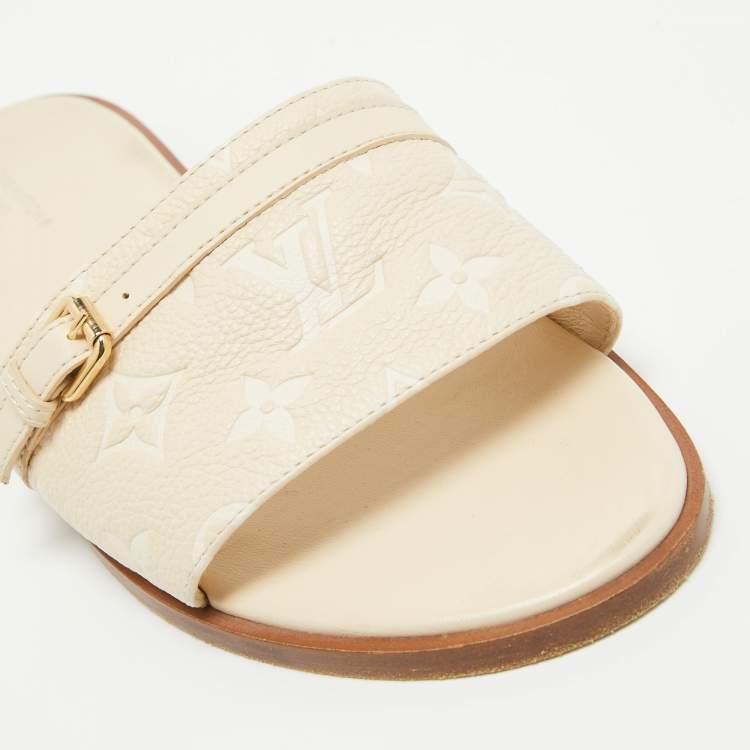 Pre Owned Louis Vuitton Cream Monogram Embossed Leather Flat Slides Size 40