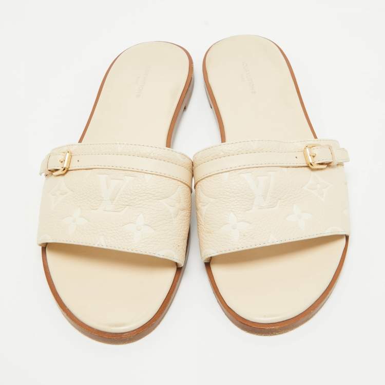 Pre Owned Louis Vuitton Cream Monogram Embossed Leather Flat Slides Size 40