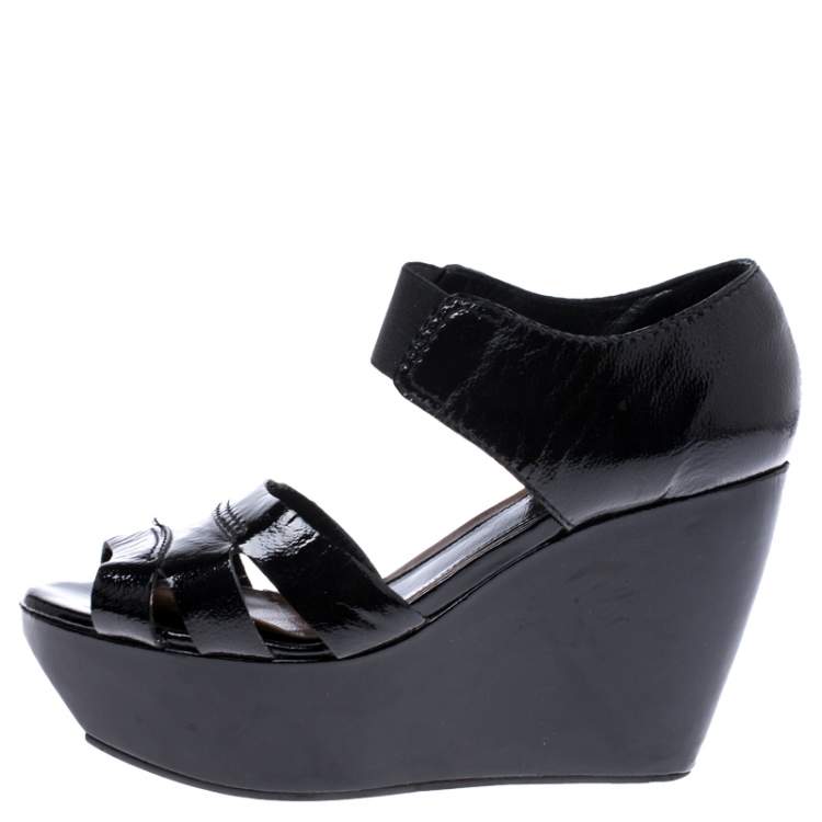 black patent leather wedges